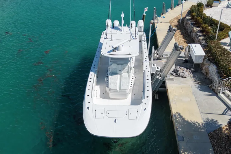 Slide: The Image of 2023 Invincible 46 Catamaran docked in clear turquoise water, aerial view. - 7