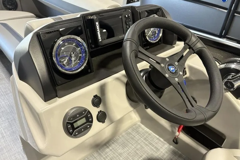 Slide: The Image of 2026 Premier 220 Sunscape RL - CL boat dashboard with steering wheel and gauges. - 15