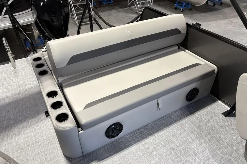 Slide: The Image of 2026 Premier 220 Sunscape RL - CL boat interior with cushioned seating and cup holders. - 18