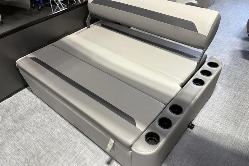 Slide: The Image of 2026 Premier 220 Sunscape RL - CL boat seating with cup holders, gray upholstery. - 21