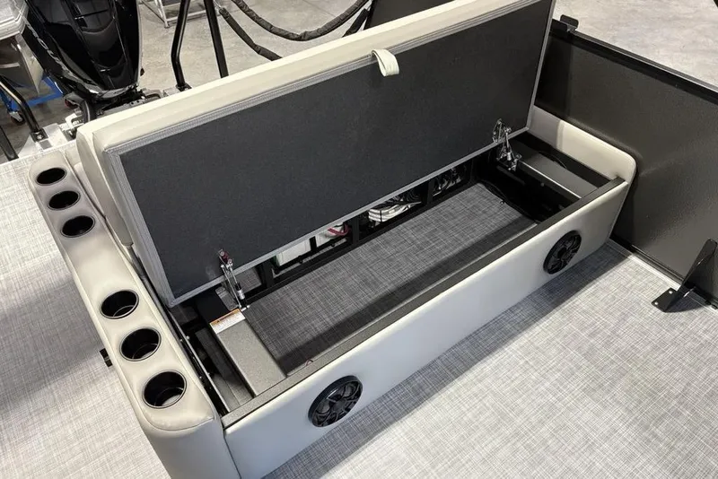 Slide: The Image of Open storage compartment in 2026 Premier 220 Sunscape RL - CL boat with cup holders. - 22