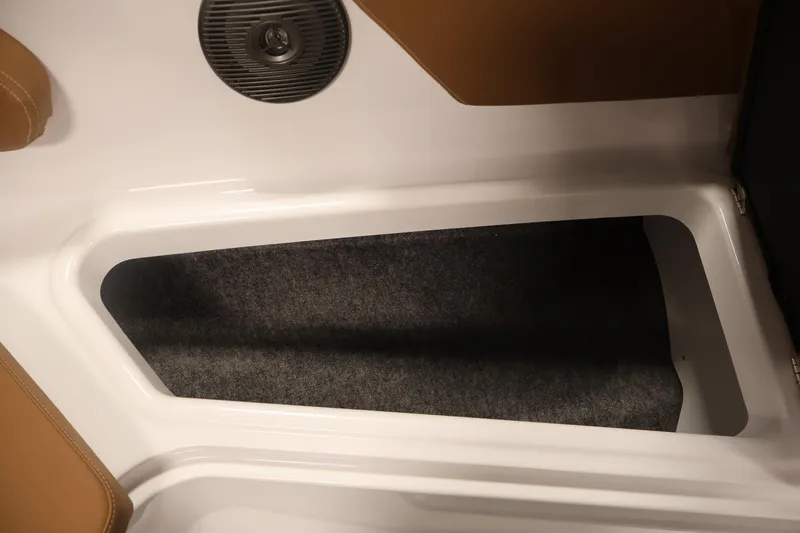 Slide: The Image of Storage compartment in 2026 Four Winns HD2 OB boat, featuring sleek design and carpeted interior. - 18