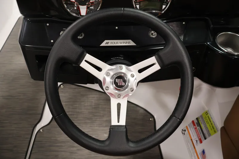 Slide: The Image of Steering wheel of 2026 Four Winns HD2 OB boat, featuring sleek design and modern controls. - 22