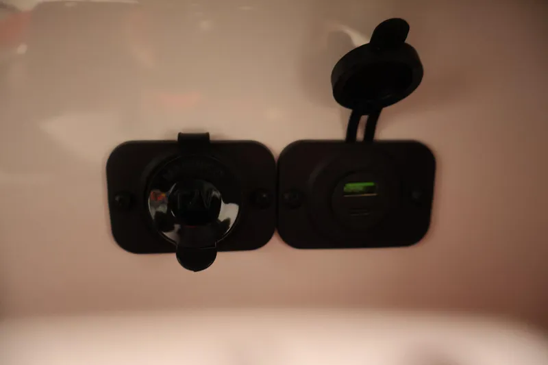 Slide: The Image of 12V and USB charging ports on 2026 Four Winns HD2 OB boat. - 31