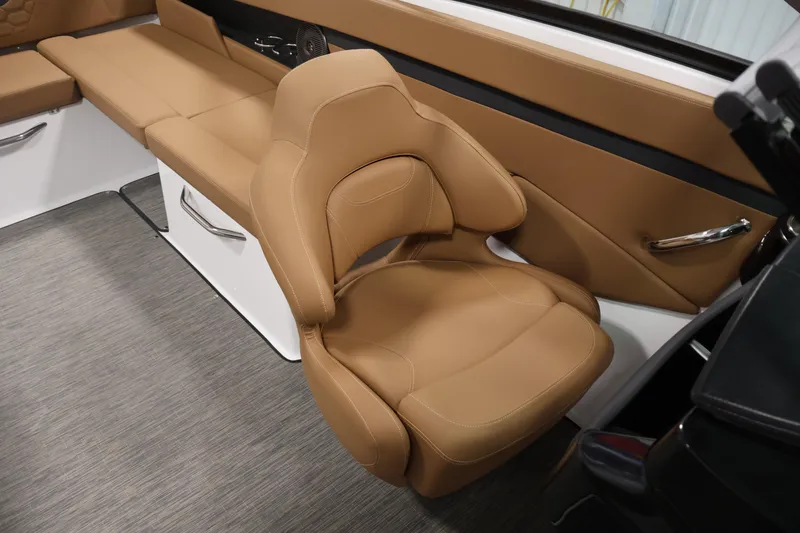 Slide: The Image of Luxurious tan seating in 2026 Four Winns HD2 OB boat interior. - 32