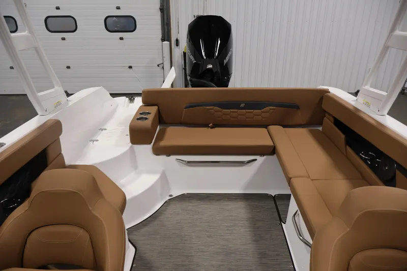Slide: The Image of 2026 Four Winns HD2 OB boat interior with tan seating and modern design. - 34