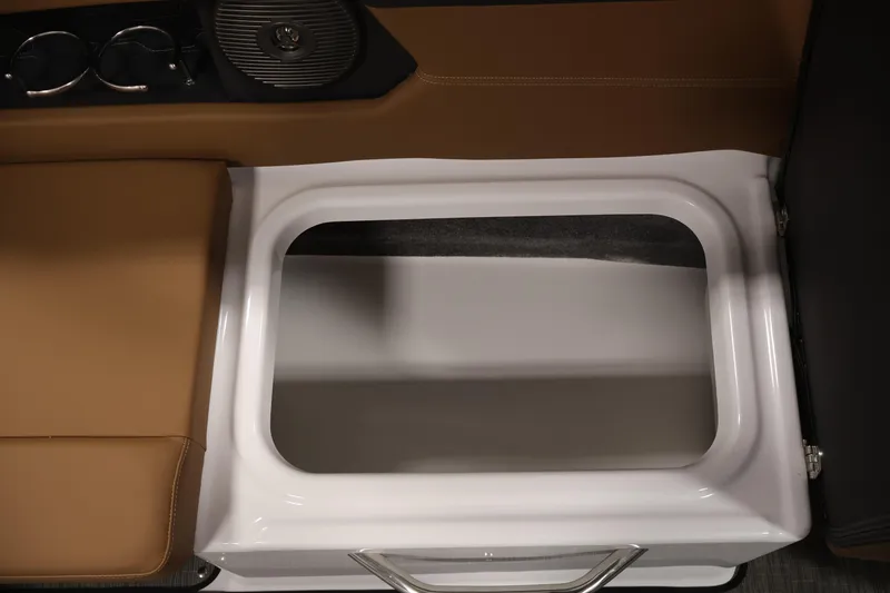Slide: The Image of Storage compartment in 2026 Four Winns HD2 OB boat with brown seating and cup holders. - 35