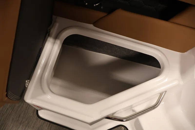 Slide: The Image of Interior storage compartment of 2026 Four Winns HD2 OB boat, featuring sleek design and metallic handle. - 38