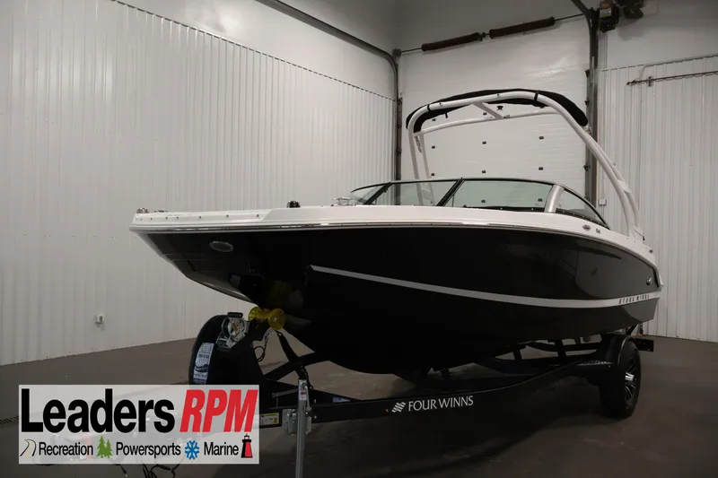 The Image of 2026 Four Winns HD2 OB boat in showroom, displayed on trailer. - 4
