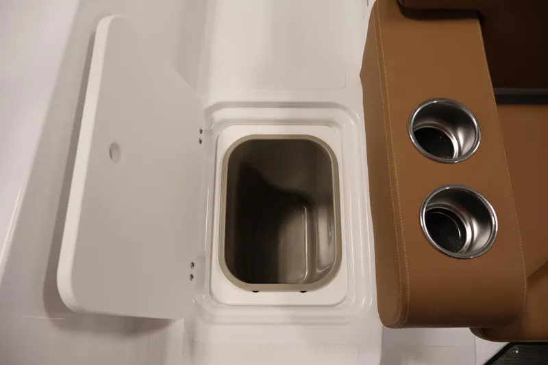 Slide: The Image of 2026 Four Winns HD2 OB boat interior with storage compartment and cup holders. - 40