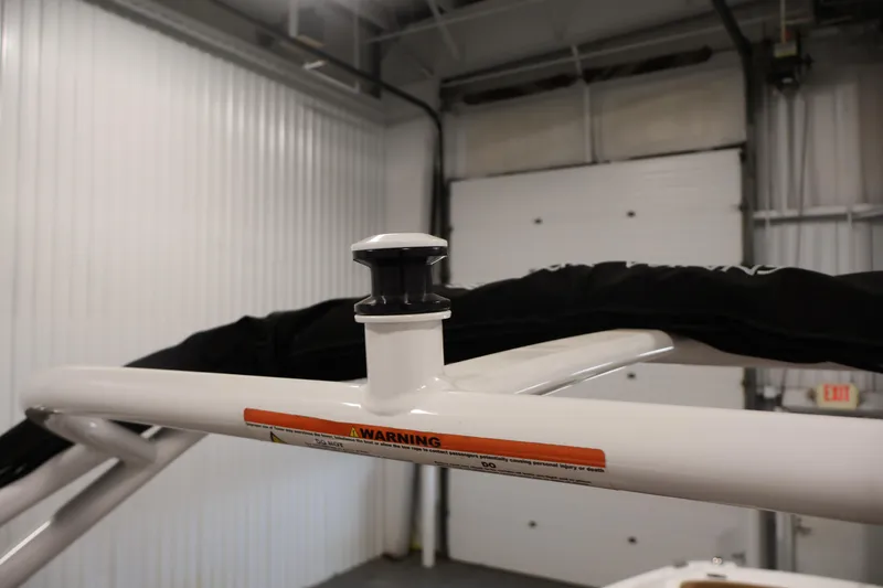 Slide: The Image of 2026 Four Winns HD2 OB boat detail in a garage setting. - 41