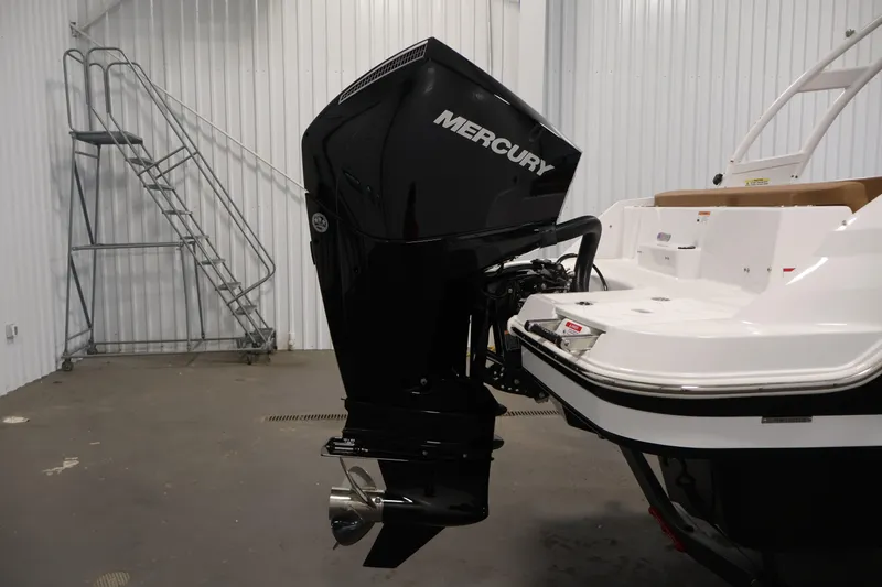 Slide: The Image of 2026 Four Winns HD2 OB boat with Mercury outboard motor in a storage facility. - 44