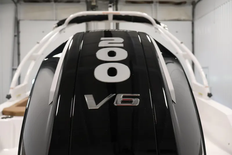 Slide: The Image of 2026 Four Winns HD2 OB boat with 200 V6 engine in a showroom. - 45