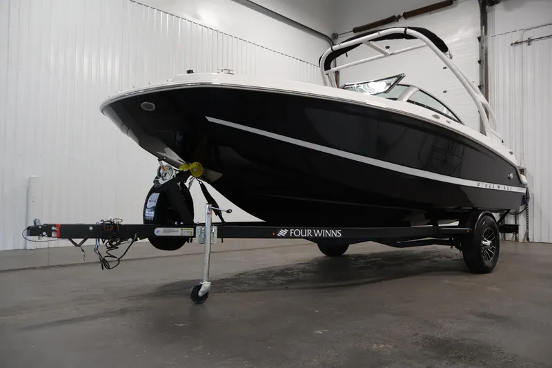 Slide: The Image of 2026 Four Winns HD2 OB boat on trailer in indoor storage facility. - 49