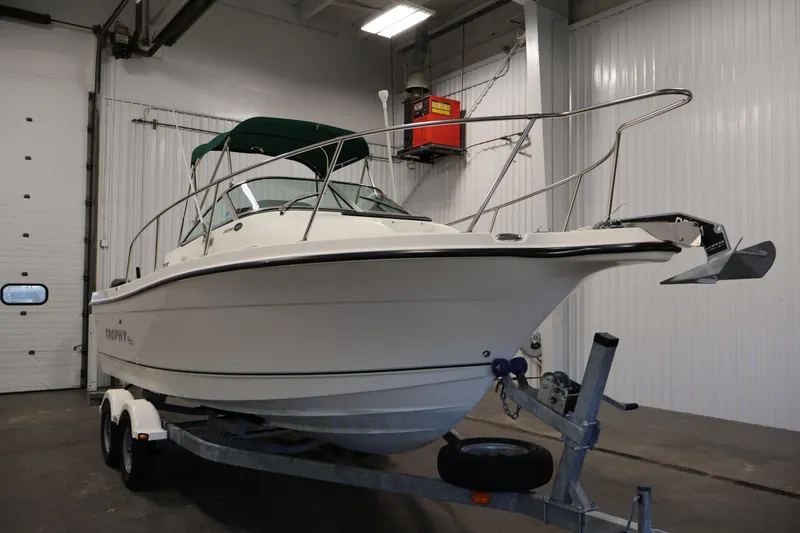 Slide: The Image of 2004 Trophy 2002 Walkaround boat on trailer in indoor storage facility. - 2