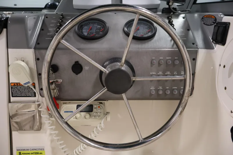 Slide: The Image of Steering wheel and dashboard of a 2004 Trophy 2002 Walkaround boat. - 20