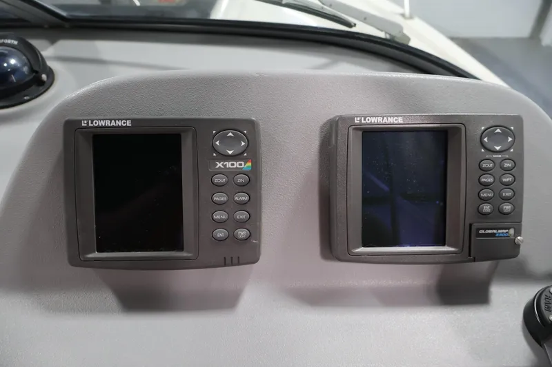 Slide: The Image of Lowrance X100 and GlobalMap 2400 displays on 2004 Trophy 2002 Walkaround boat dashboard. - 22