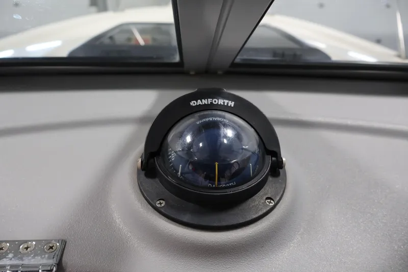 Slide: The Image of Danforth compass on 2004 Trophy 2002 Walkaround boat dashboard. - 23