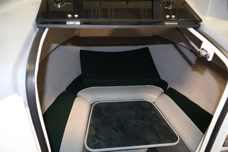 Slide: The Image of 2004 Trophy 2002 Walkaround cabin interior with seating and table. - 34