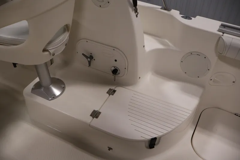Slide: The Image of 2004 Trophy 2002 Walkaround boat interior with seating and storage compartments. - 38