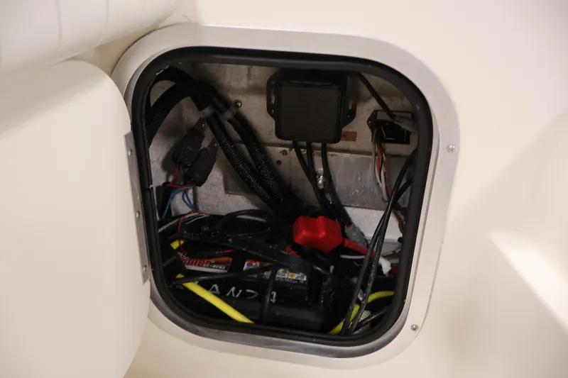 Slide: The Image of Electrical compartment of a 2004 Trophy 2002 Walkaround boat, showing wiring and components. - 42