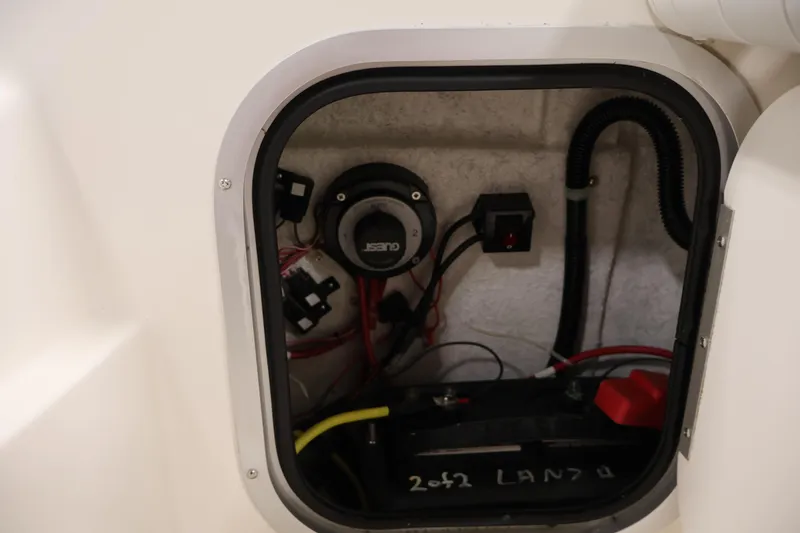 Slide: The Image of Electrical compartment of a 2004 Trophy 2002 Walkaround boat, showing wiring and components. - 45