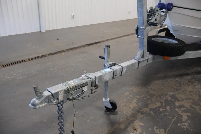 Slide: The Image of Trailer hitch of a 2004 Trophy 2002 Walkaround boat in a garage setting. - 55