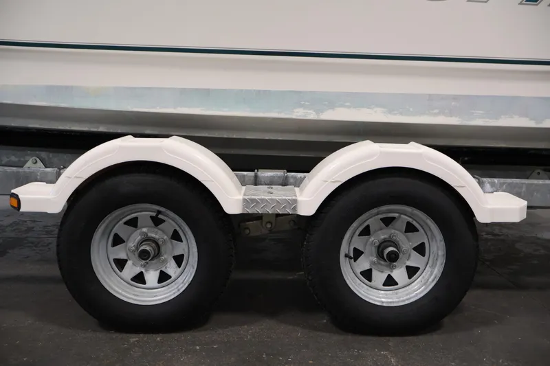 Slide: The Image of Trailer wheels of a 2004 Trophy 2002 Walkaround boat. - 58