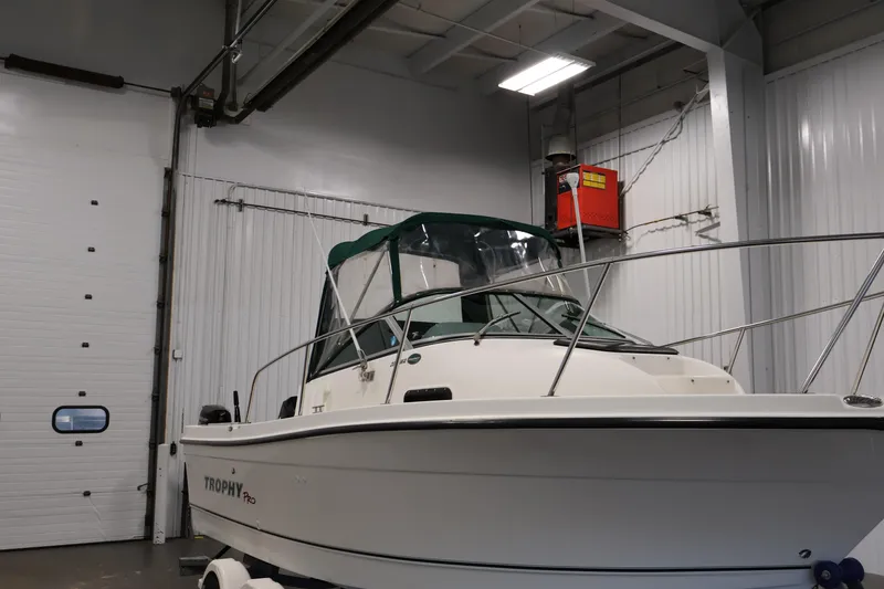 Slide: The Image of 2004 Trophy 2002 Walkaround boat in indoor storage facility. - 59