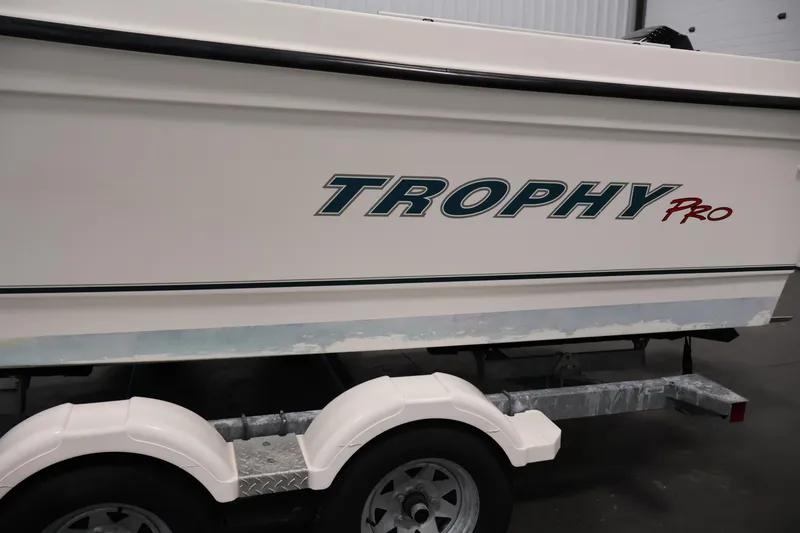 Slide: The Image of 2004 Trophy 2002 Walkaround boat on trailer, side view with logo. - 67