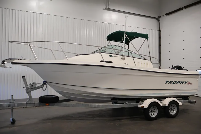 Slide: The Image of 2004 Trophy 2002 Walkaround boat on trailer in indoor storage. - 7