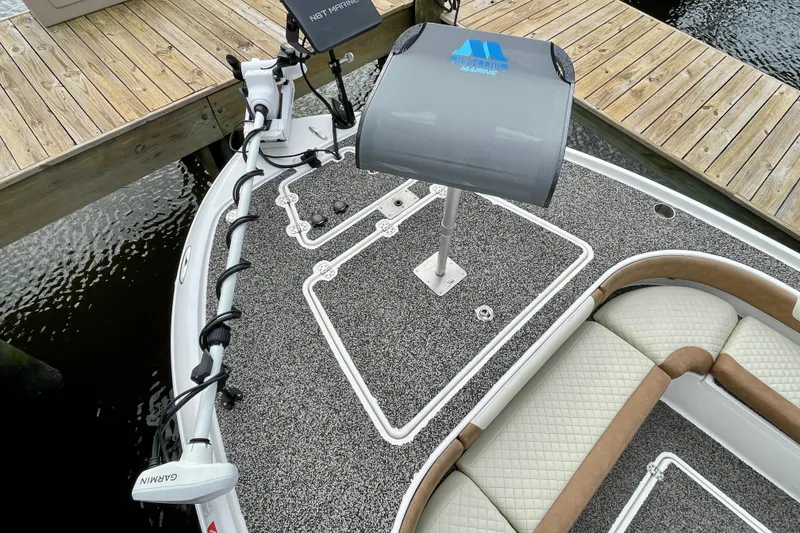 Slide: The Image of 2021 Caymas 26 HB boat deck with Garmin equipment and cushioned seating. - 10