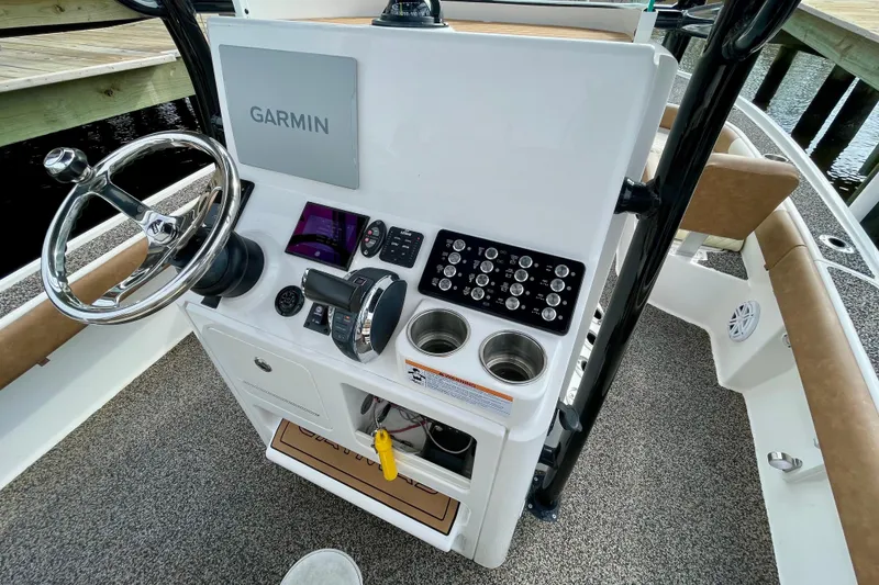 Slide: The Image of 2021 Caymas 26 HB boat console with Garmin navigation and control panel. - 20