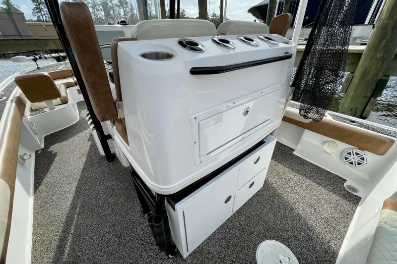 Slide: The Image of 2021 Caymas 26 HB boat interior with seating and storage compartments. - 23