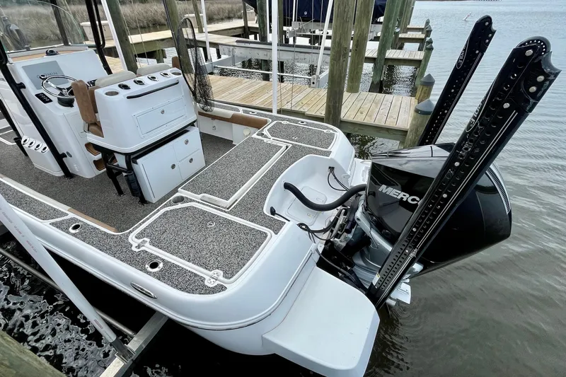 Slide: The Image of 2021 Caymas 26 HB boat with Mercury engine docked at marina. - 6