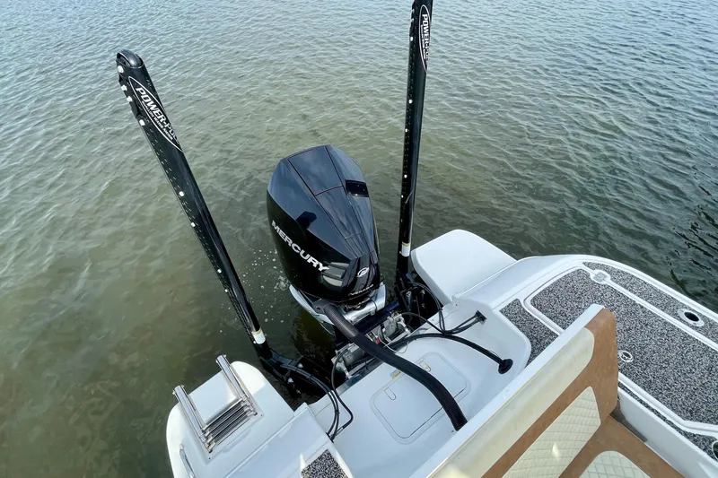 Slide: The Image of 2021 Caymas 26 HB boat with Mercury engine on calm water. - 8