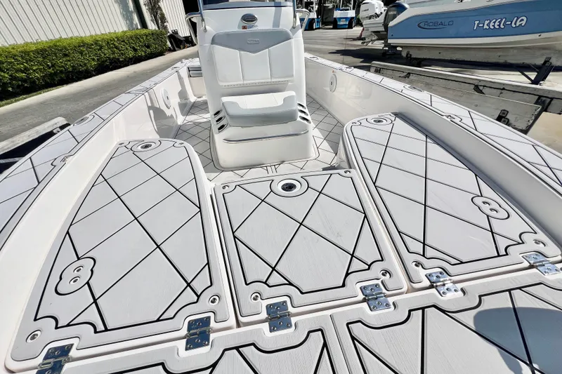 Slide: The Image of 2019 Robalo 206 Cayman boat deck with seating and storage compartments. - 16