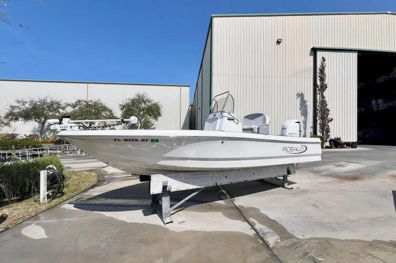Slide: The Image of 2019 Robalo 206 Cayman boat on trailer outside storage facility. - 3