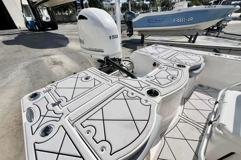 Slide: The Image of 2019 Robalo 206 Cayman boat with Yamaha 150 engine, featuring sleek deck design. - 8