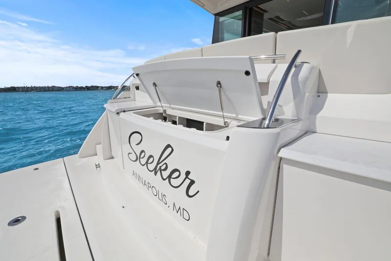 Slide: The Image of 2023 Tiara Yachts C49 Coupe, rear view with "Seeker" name, Annapolis, MD. - 13