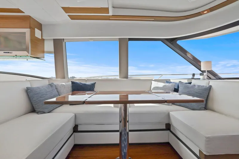 Slide: The Image of Luxurious interior of 2023 Tiara Yachts C49 Coupe with elegant seating and panoramic windows. - 36