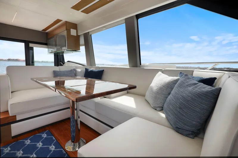 Slide: The Image of Luxurious interior of 2023 Tiara Yachts C49 Coupe with elegant seating and scenic views. - 39