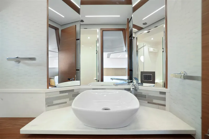 Slide: The Image of Luxurious bathroom in 2023 Tiara Yachts C49 Coupe with modern sink and elegant design. - 58