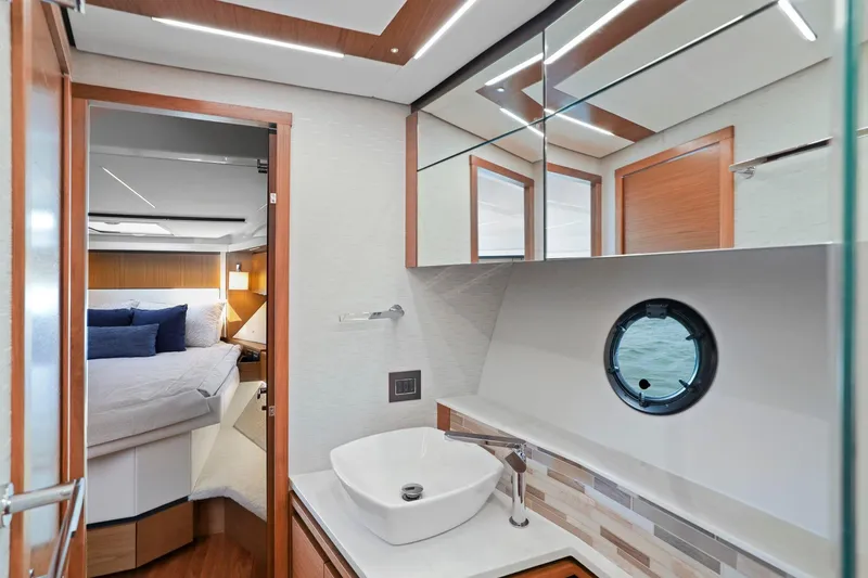 Slide: The Image of Luxurious interior of 2023 Tiara Yachts C49 Coupe, featuring modern bathroom and cozy bedroom. - 67