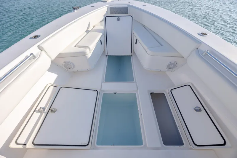 Slide: The Image of 2013 Contender 32 Tournament boat interior with storage compartments and seating. - 10