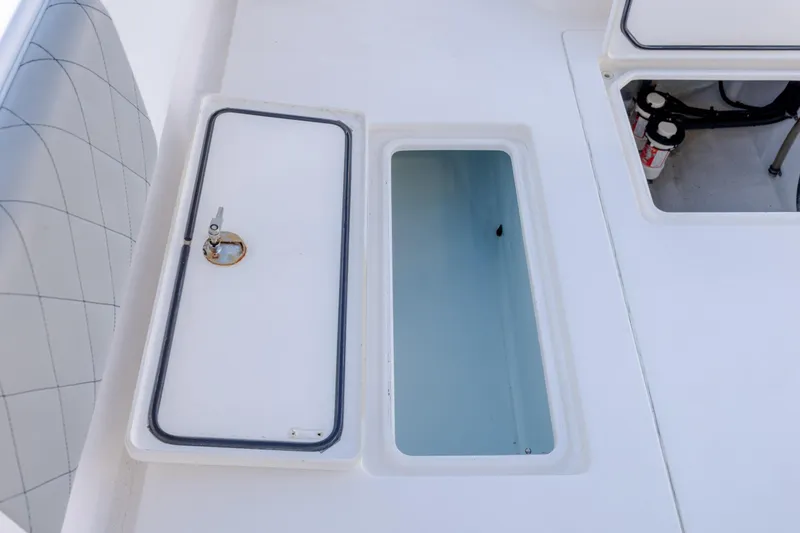 Slide: The Image of 2013 Contender 32 Tournament boat storage compartments and seating detail. - 11