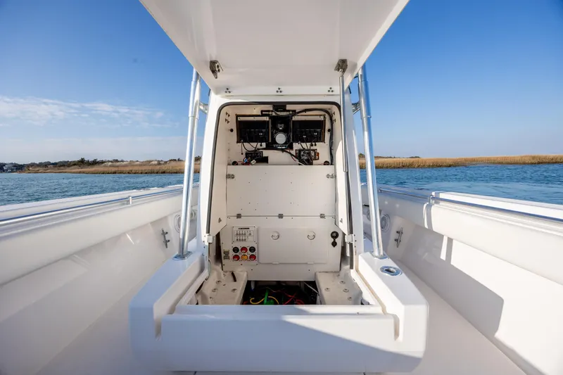 Slide: The Image of 2013 Contender 32 Tournament boat interior with open console, on calm water. - 17