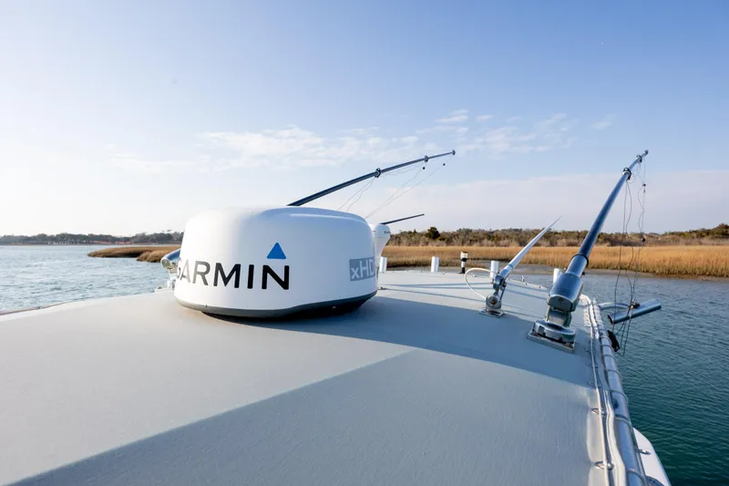 Slide: The Image of 2013 Contender 32 Tournament boat with Garmin radar on calm water. - 29