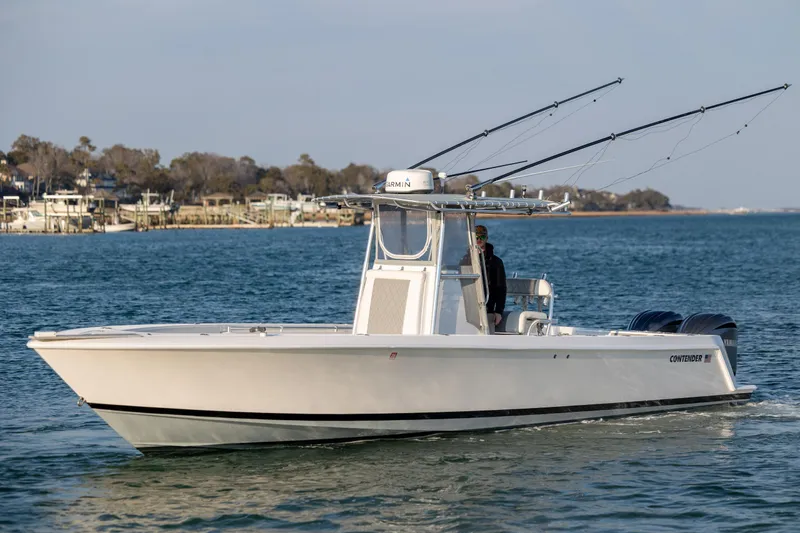 Slide: The Image of 2013 Contender 32 Tournament boat cruising on calm waters. - 3