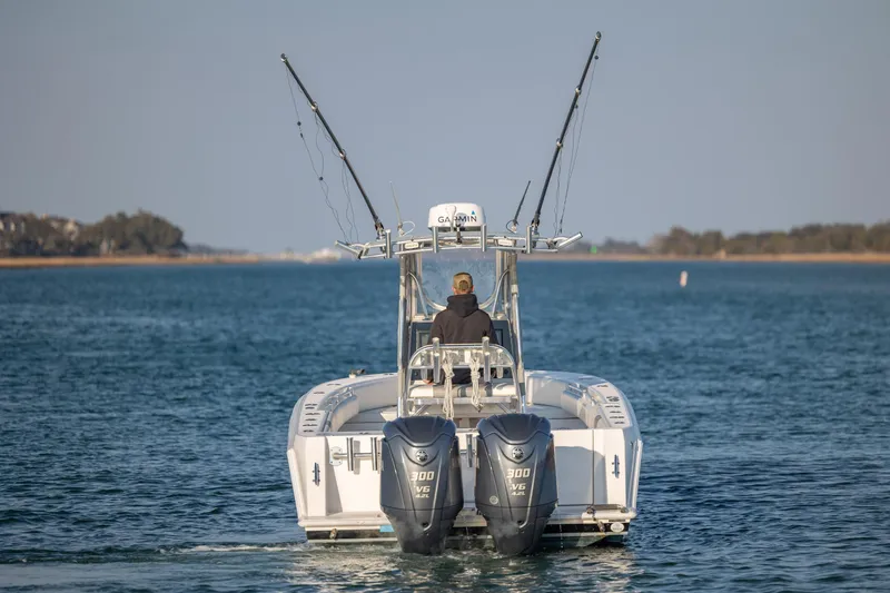 Slide: The Image of 2013 Contender 32 Tournament boat with dual engines on open water. - 6